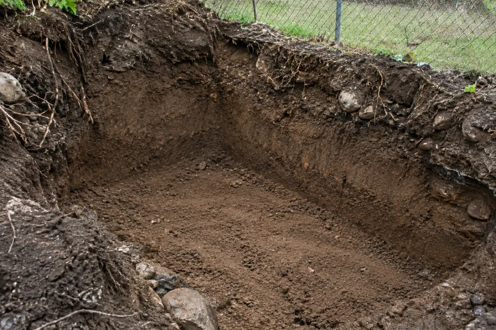 After: empty excavation once the oil tank was removed